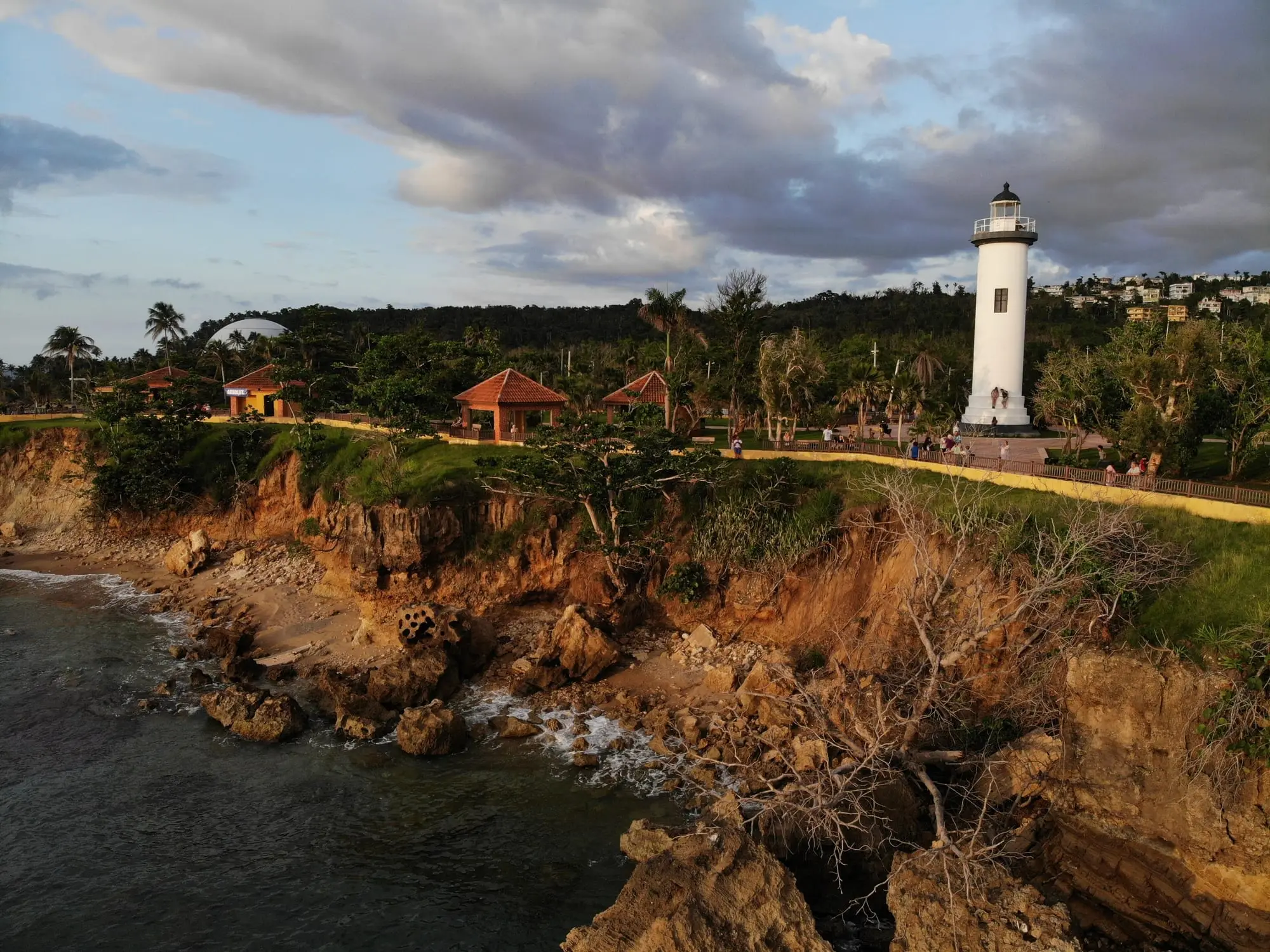 Punta Higüero lighthouse on the cliffs of Rincón, with the coastal park around it