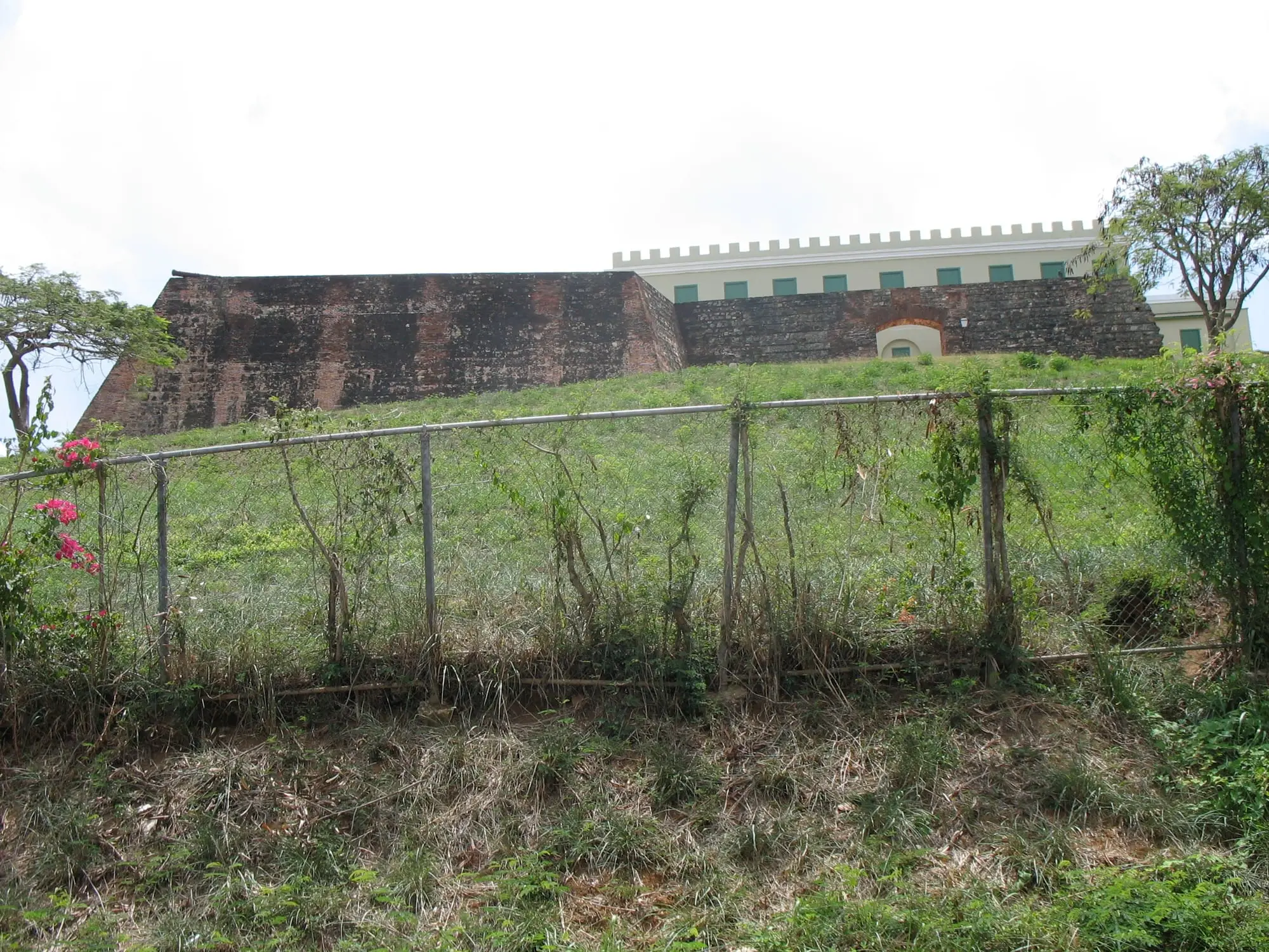 The walls of Fortín Conde de Mirasol on a green hill above Isabel Segunda, in Vieques